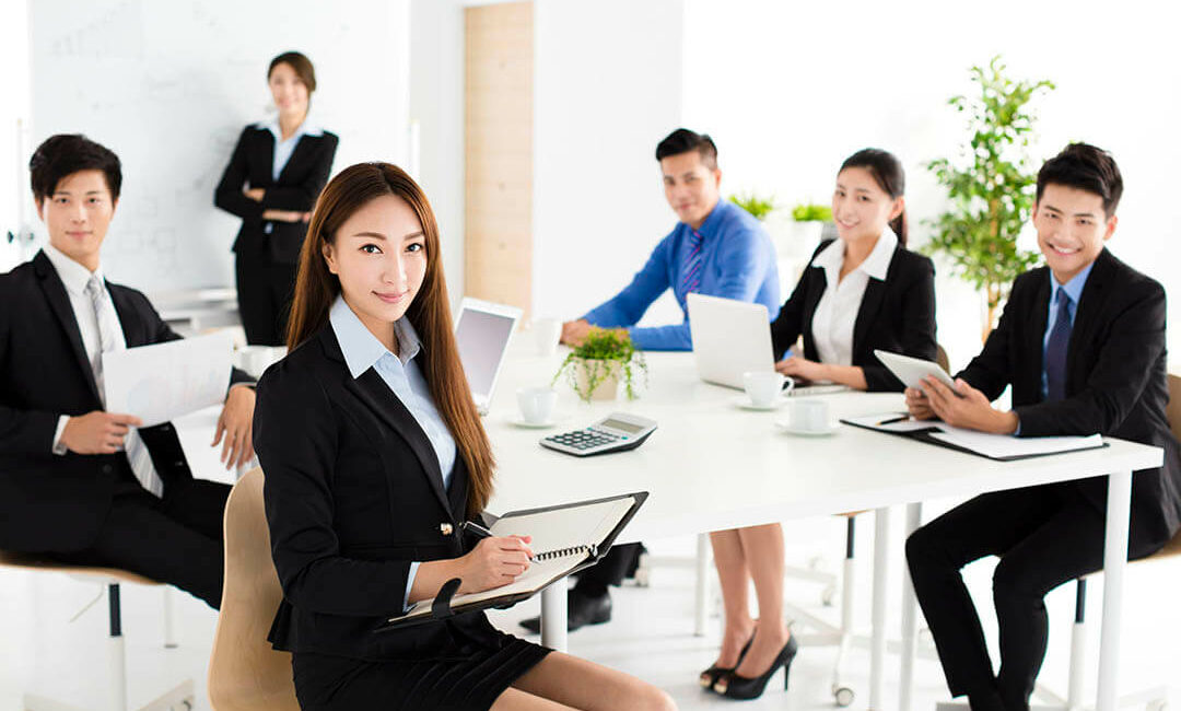 Group of happy young business people in meeting